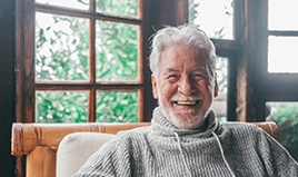 Closeup of senior man smiling at home