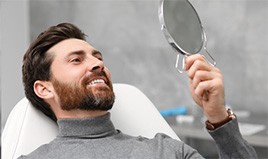 Man smiling with his new dental implants 